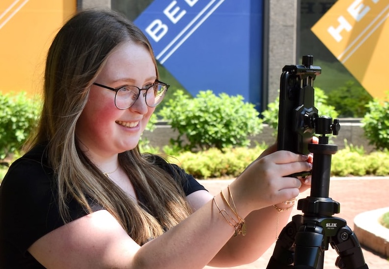 Jordan taking campus photos for social media