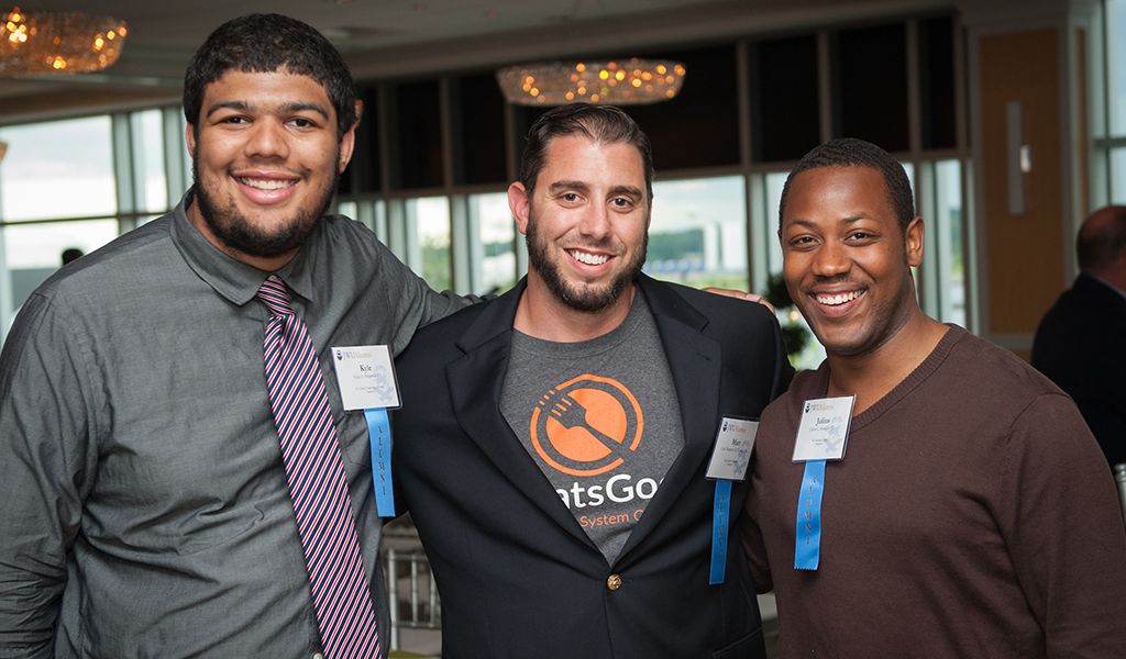 JWU alums, including Matt Tortora, enjoying an alumni event JWU alums, including Matt Tortora (center), at an event