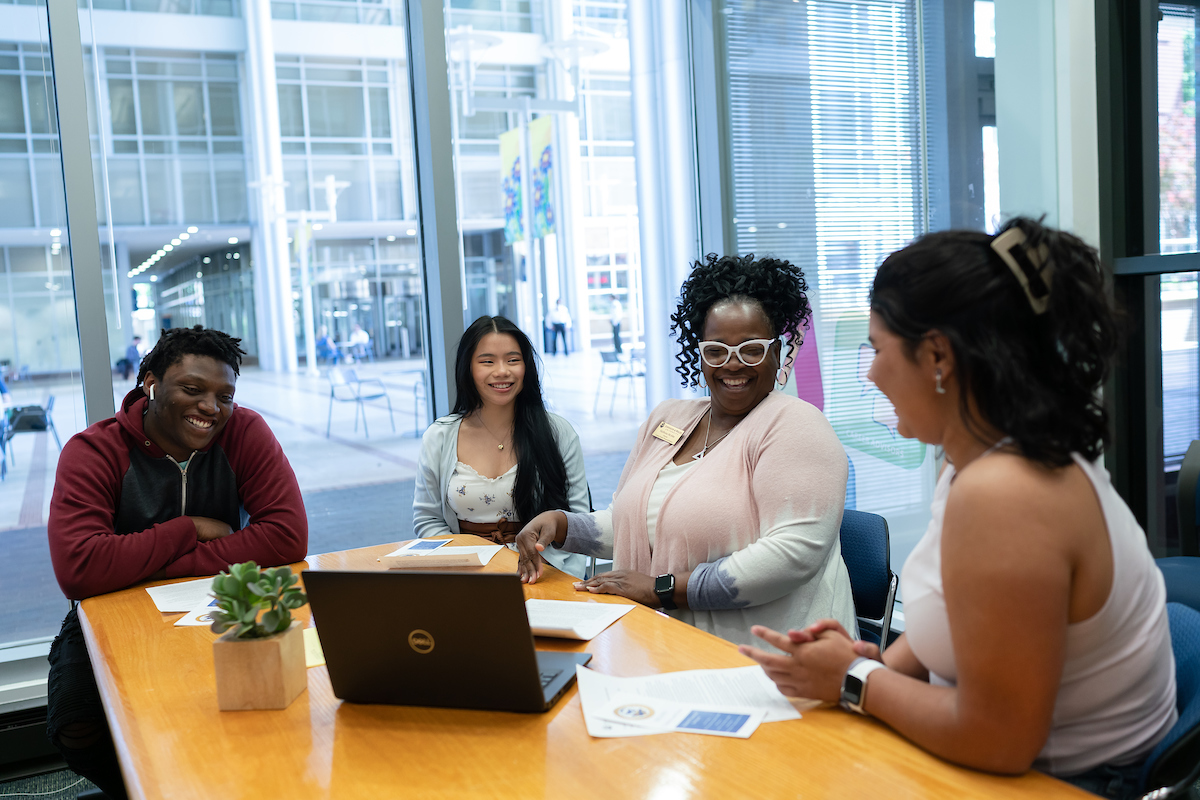 student financial advisor helping students with paperwork
