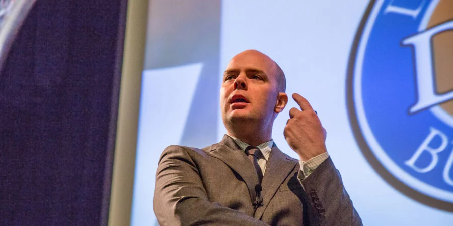 Joshua Wright '97 speaking at JWU’s Providence Campus.