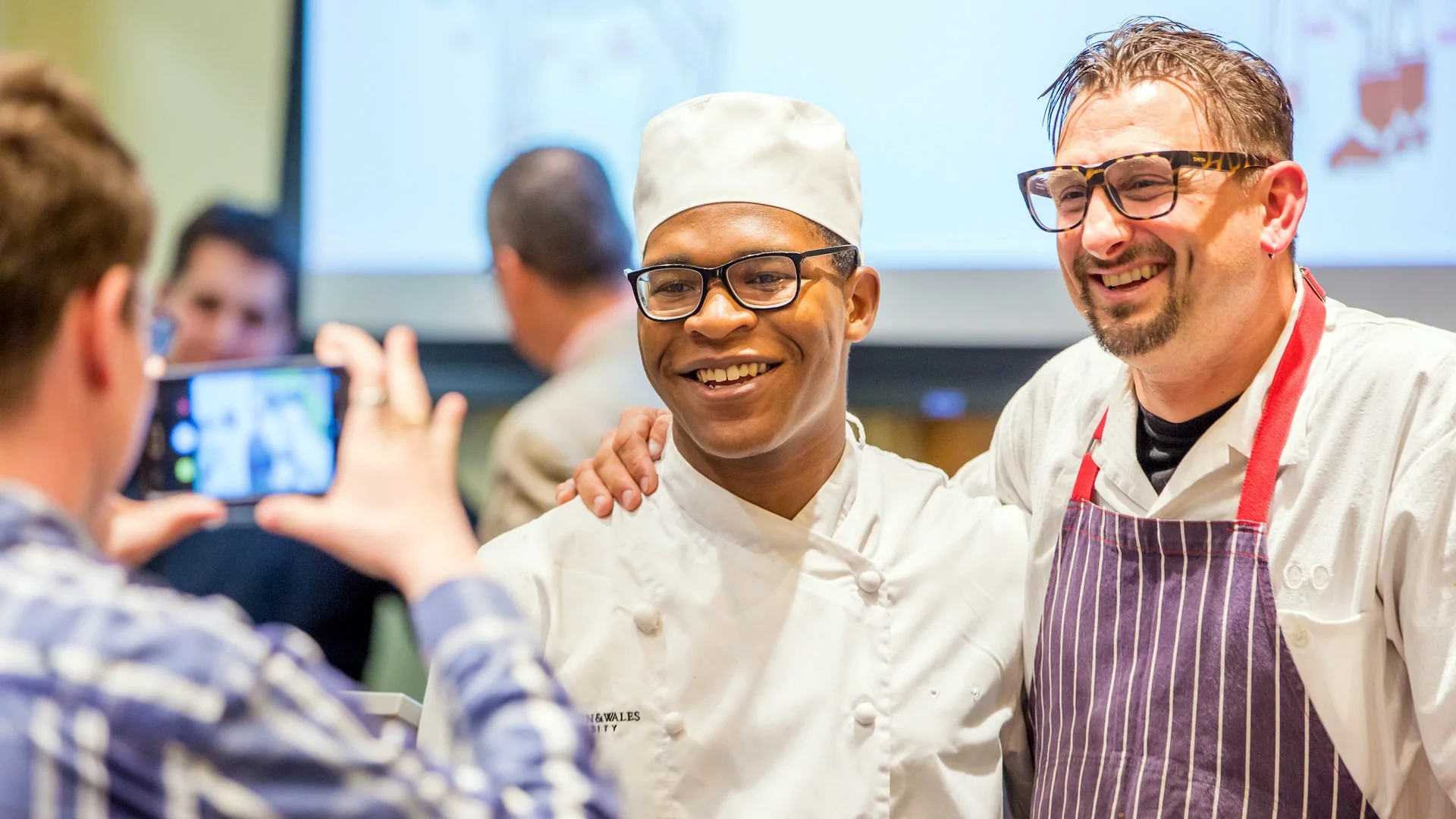DVC Chris Cosentino with a JWU student.