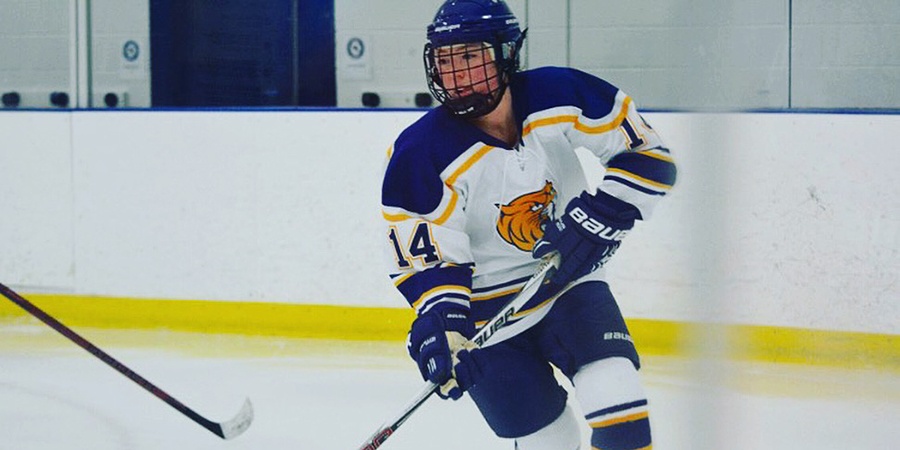 JWU student Kathy Ensor playing hockey