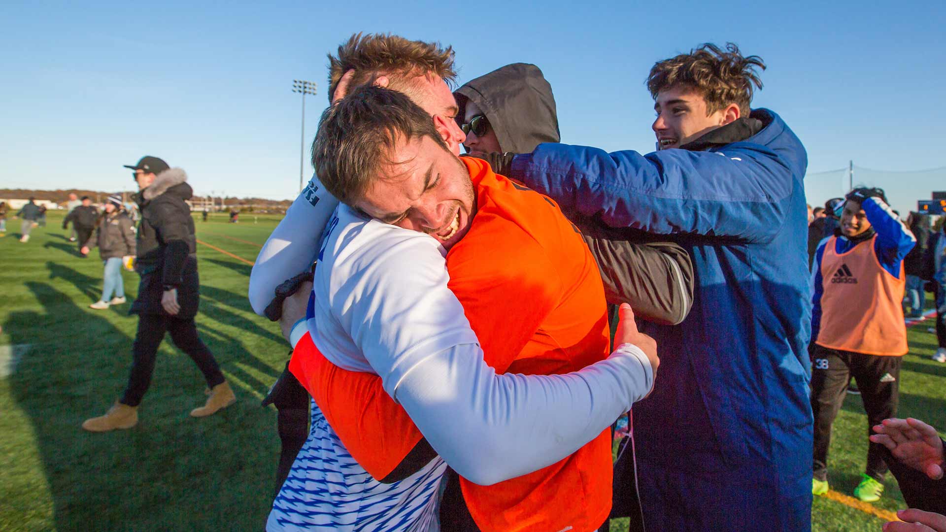 Two JWU men's soccer players react to their GNAC win.