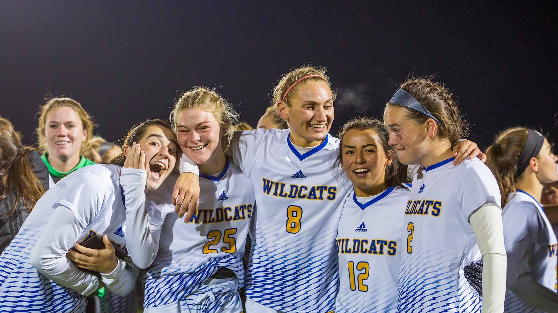 The women's soccer team reacts to their win.