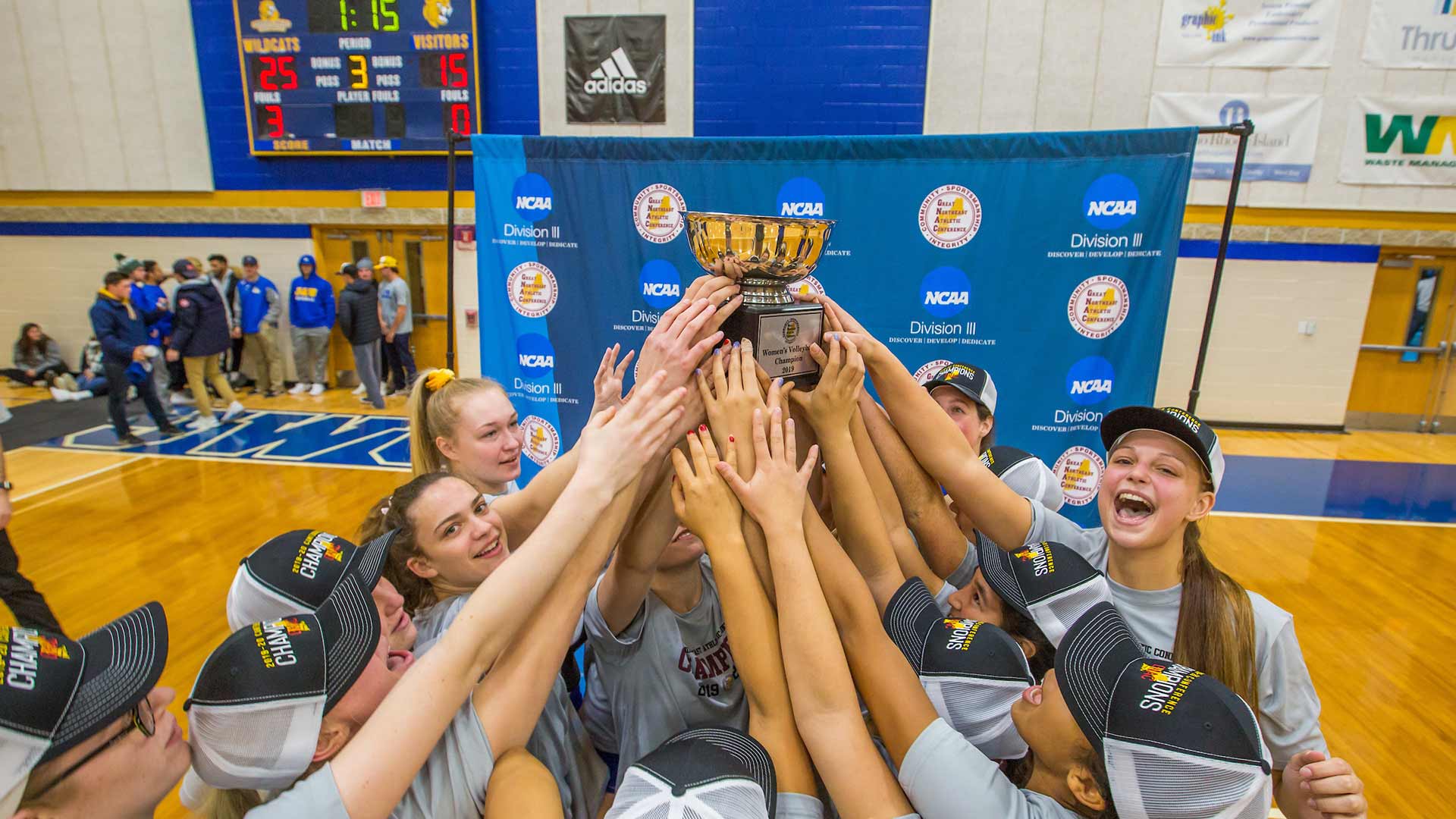 With the trophy.