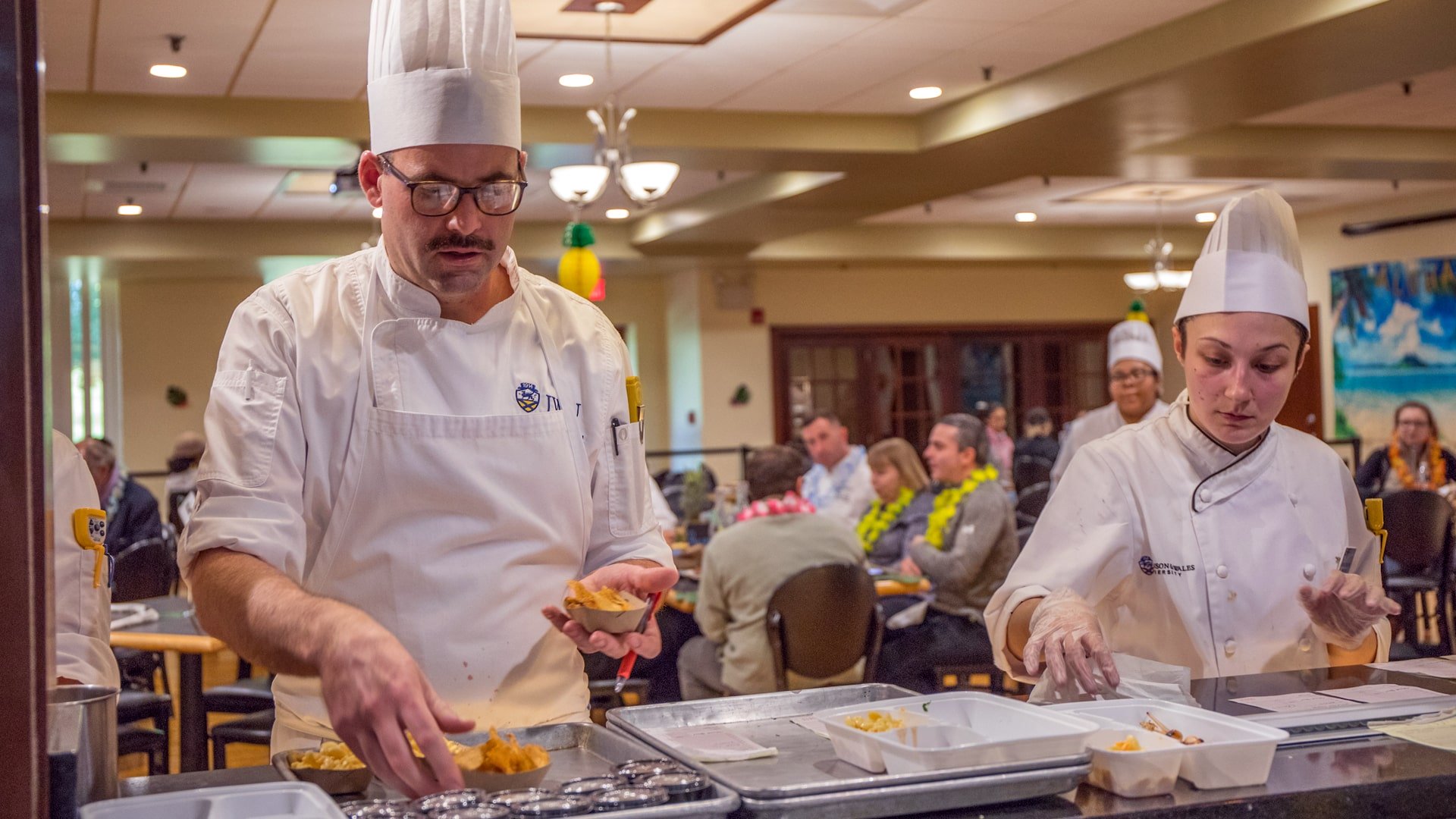 Chef Matthew Britt helps check orders Expediting orders.