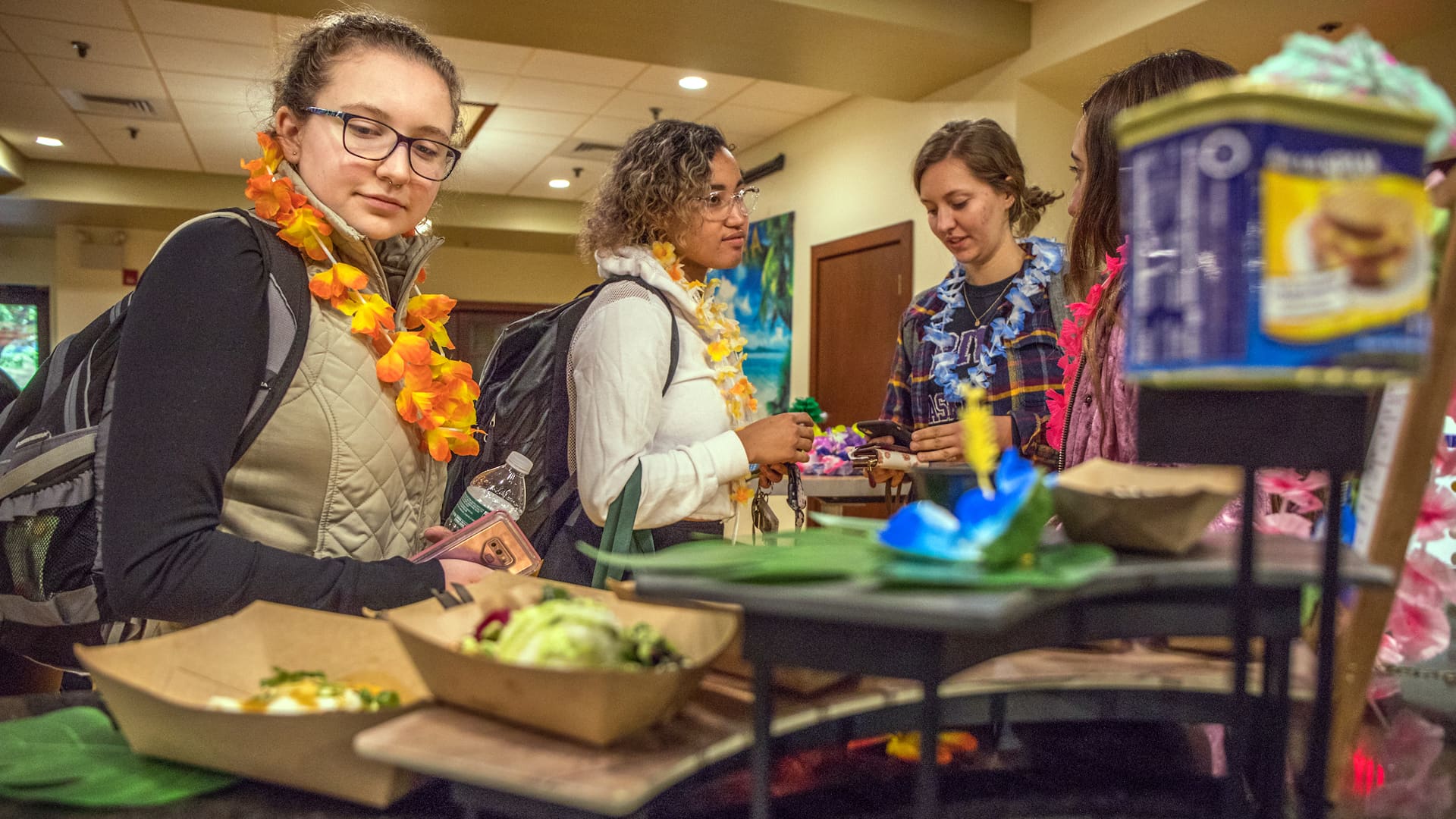 JWU students picking up to-go orders at Ohana, a Hawaiian themed pop-up run by students Picking up a to-go order.