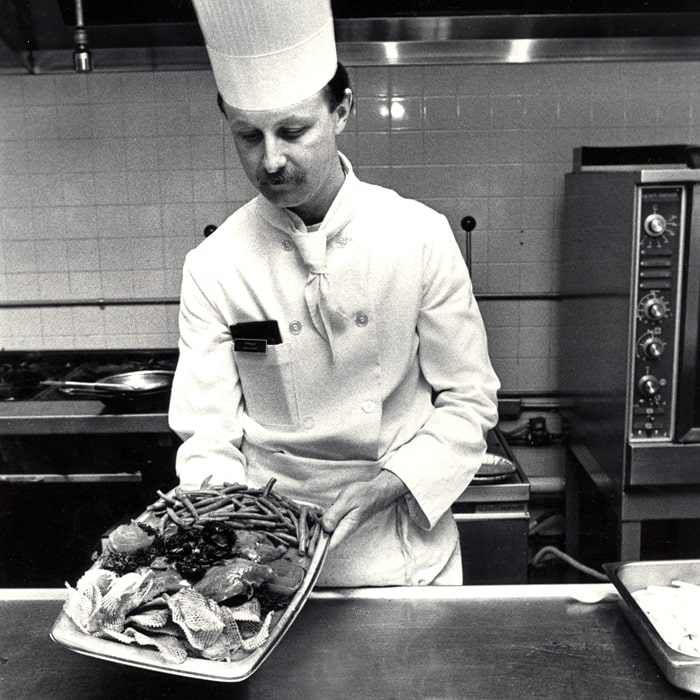 JWU archive image of Kevin Duffy at work in the JWU kitchens, circa 1979. Kevin Duffy M.A.T. '04 working at JWU Providence in the early days, circa 1979.