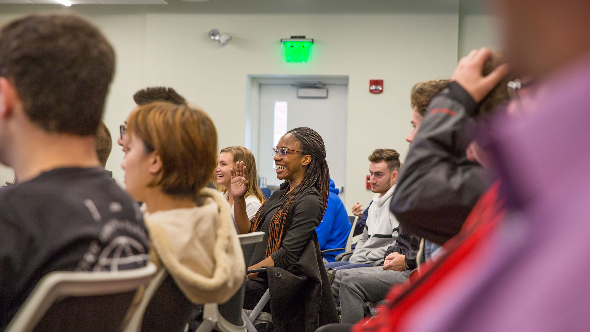 a student smiles during a JWU class discussion