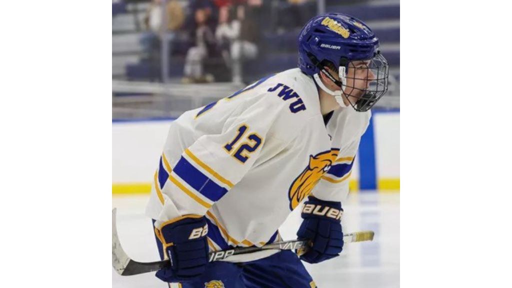 photo of Davis Bone '26 playing hockey in his JWU uniform