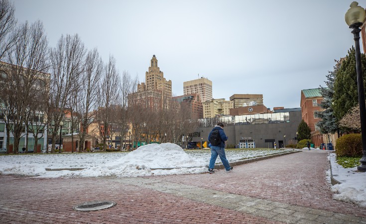 Student Walking Through Gaebe in the Winter