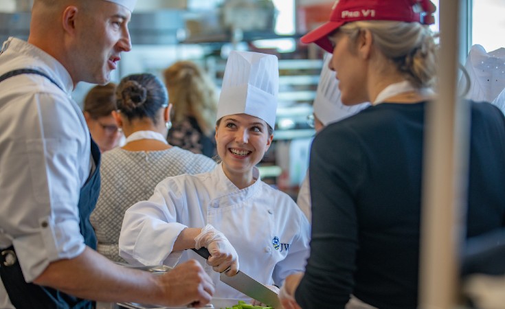 students cooking at JWU's Kitchen Academy